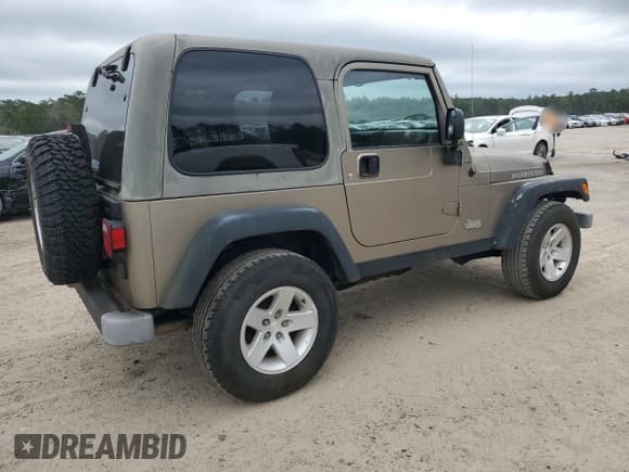 ✅ 2004 Jeep Wrangler Rubicon • VIN: 1J4FA69S34P756394 • Lot: 86123855. Wystawiony na Copart z przebiegiem 62 500 mil. Bezpłatny archiwum sprzedaży aukcyjnych z USA i szczegółowy raport historii pojazdu na DreamBid. Zdjęcie 3.