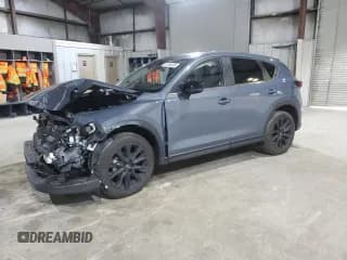 ✅ 2024 Mazda CX-5 S Carbon Edition • VIN: JM3KFBCL6R0431990 • Лот: 91164435. Опубликован ранее на Copart с пробегом 16 680 миль. Бесплатный доступ к архиву аукционных продаж из США и подробный отчёт об истории автомобиля на DreamBid. Изображение 1.