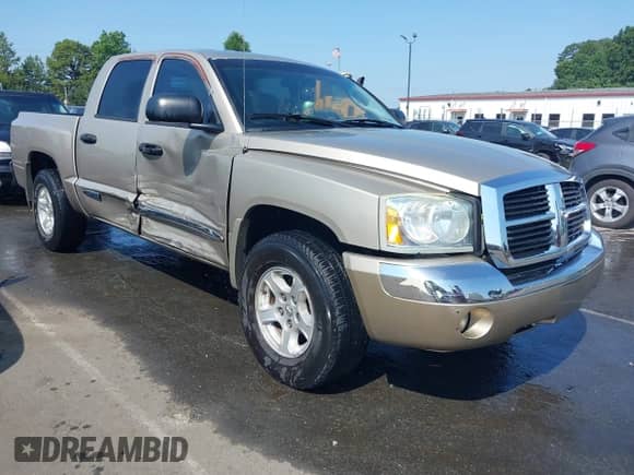 2005 Dodge Dakota Laramie with VIN 1D7HE58N65S128701, listed as a IAAI auction lot 42612813 with 133,800 mi miles and . Bid and sale history available at DreamBid. Image 1.