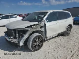 ✅ 2016 Honda Pilot EX-L • VIN: 5FNYF5H73GB013904 • Lot: 82594615. Listed on Copart with 121,706 mi. Free auction sales archive from the USA and detailed vehicle history report at DreamBid. Image 1.