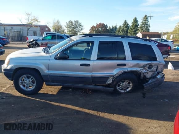 ✅ 2002 Jeep Grand Cherokee Laredo • VIN: 1J4GW48S22C256176 • Lot: 43420528. Listed on IAAI with 226,359 mi. Free auction sales archive from the USA and detailed vehicle history report at DreamBid. Image 14.