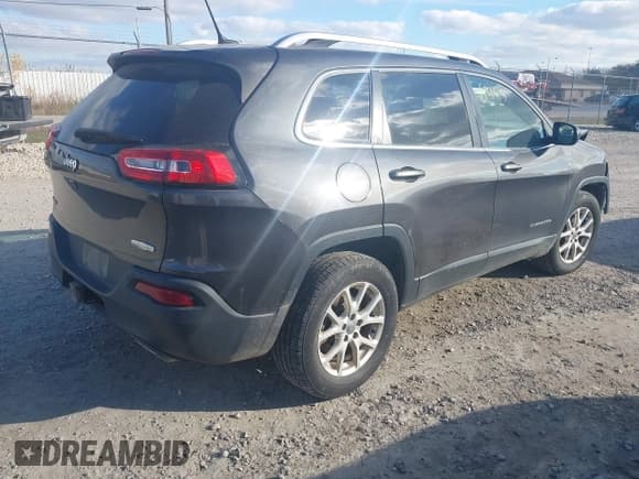 ✅ 2015 Jeep Cherokee Latitude • VIN: 1C4PJMCS6FW528292 • Lot: 43561483. Listed on IAAI with 136,416 mi. Free auction sales archive from the USA and detailed vehicle history report at DreamBid. Image 4.