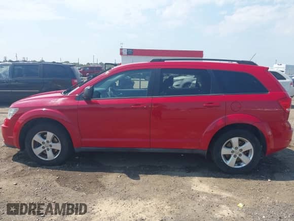 2013 Dodge Journey American Value with VIN 3C4PDCAB7DT500881, listed as a IAAI auction lot 43193439 with 165,029 mi miles and . Bid and sale history available at DreamBid. Image 14.