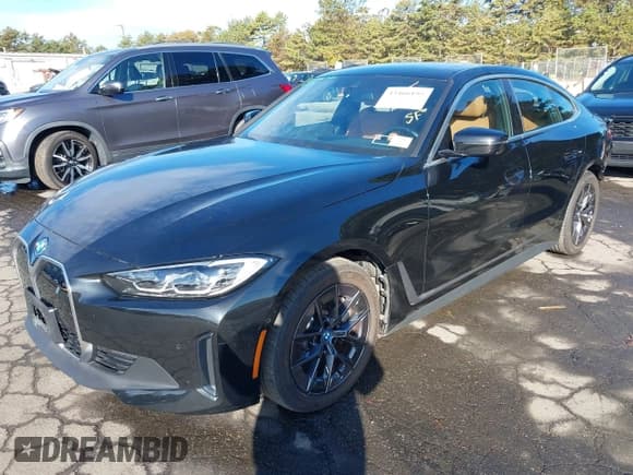 ✅ 2023 BMW i4 eDrive35 • VIN: WBY43AW03PFR34150 • Lot: 43466195. Listed on IAAI with 13,238 mi. Free auction sales archive from the USA and detailed vehicle history report at DreamBid. Image 2.
