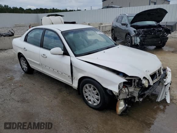 ✅ 2003 Kia Optima LX • VIN: KNAGD126335210008 • Lot: 67408705. Listed on Copart with 212,574 mi. Free auction sales archive from the USA and detailed vehicle history report at DreamBid. Image 4.