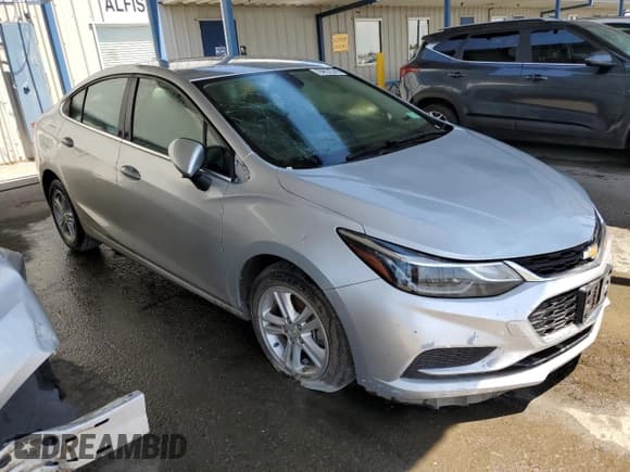 ✅ 2018 Chevrolet Cruze LT • VIN: 1G1BE5SM8J7189487 • Lot: 62569483. Listed on Copart with 126,588 mi. Free auction sales archive from the USA and detailed vehicle history report at DreamBid. Image 4.