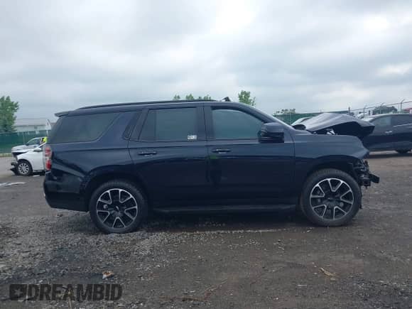 2021 Chevrolet Tahoe RST with VIN 1GNSKRKD6MR493215, listed as a IAAI auction lot 42637936 with 43,116 mi miles and . Bid and sale history available at DreamBid. Image 13.