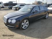 ✅ 2015 Bentley Flying Spur • VIN: SCBEC9ZA1FC049618 • Lot: 83489764. Listed on Copart with 85,979 mi. Free auction sales archive from the USA and detailed vehicle history report at DreamBid. Image 1.