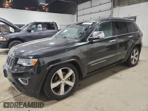 ✅ 2014 Jeep Grand Cherokee Overland • VIN: 1C4RJFCG9EC339863 • Lot: 90741315. Listed on Copart with 143,485 mi. Free auction sales archive from the USA and detailed vehicle history report at DreamBid. Image 1.