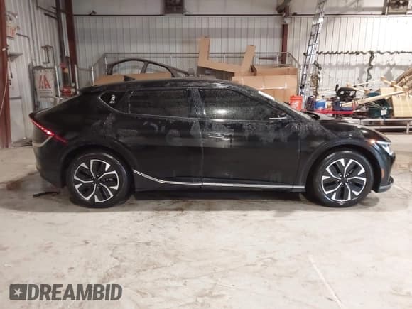 ✅ 2022 Kia EV6 Wind • VIN: KNDC3DLC0N5048724 • Лот: 43564486. Опубликован ранее на IAAI с пробегом 103 944 миль. Бесплатный доступ к архиву аукционных продаж из США и подробный отчёт об истории автомобиля на DreamBid. Изображение 13.