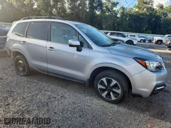 2017 Subaru Forester Limited with VIN JF2SJARC4HH510116, listed as a Copart auction lot 82122265 with 87,527 mi miles and Salvage title. Bid and sale history available at DreamBid. Image 4.