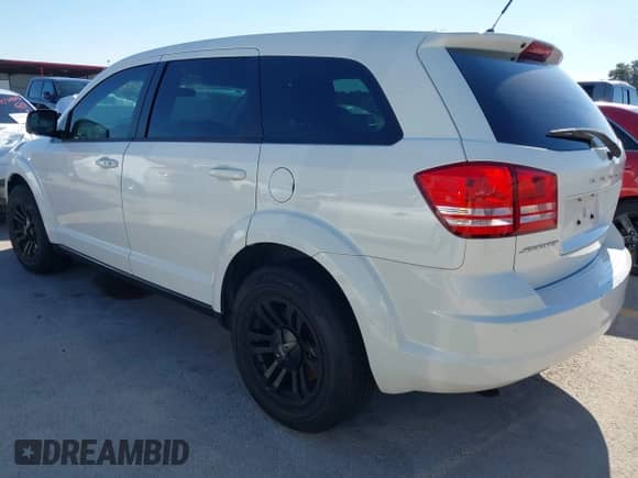 2015 Dodge Journey American Value z VIN 3C4PDCAB0FT540285, wystawiony jako IAAI lot #43610721 z przebiegiem 208 916 mil mil oraz . Historia ofert i sprzedaży dostępna na DreamBid. Obrazek 3.