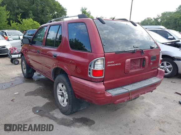 ✅ 2004 Isuzu Rodeo S • VIN: 4S2CK58Y444303591 • Lot: 42707772. Listed on IAAI with 156,792 mi. Free auction sales archive from the USA and detailed vehicle history report at DreamBid. Image 3.