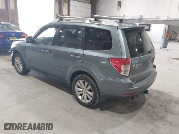 ✅ 2012 Subaru Forester X Touring • VIN: JF2SHAHC1CH406270 • Lot: 42166953. Listed on IAAI with 144,843 mi. Free auction sales archive from the USA and detailed vehicle history report at DreamBid. Image 3.