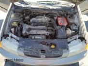 ✅ 1998 Mazda Protege DX • VIN: JM1BC1414W0203670 • Лот: 62966544. Опубликован ранее на Copart с пробегом 249 405 миль. Бесплатный доступ к архиву аукционных продаж из США и подробный отчёт об истории автомобиля на DreamBid. Изображение 11.