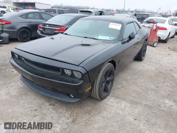 2014 Dodge Challenger R/T 100th Anniversary Appearance with VIN 2C3CDYBT6EH242063, listed as a IAAI auction lot 41490675 with 143,802 mi miles and . Bid and sale history available at DreamBid. Image 17.