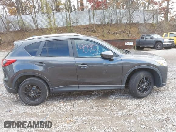 ✅ 2015 Mazda CX-5 Grand Touring • VIN: JM3KE4DY8F0461450 • Lot: 43599095. Listed on IAAI with 137,866 mi. Free auction sales archive from the USA and detailed vehicle history report at DreamBid. Image 13.