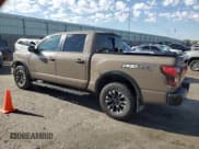 ✅ 2021 Nissan Titan Pro-4X • VIN: 1N6AA1ED9MN514521 • Lot: 64480615. Listed on Copart with 63,765 mi. Free auction sales archive from the USA and detailed vehicle history report at DreamBid. Image 2.