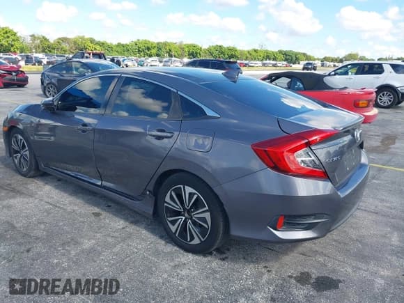 ✅ 2017 Honda Civic EX-T • VIN: 2HGFC1F34HH640486 • Lot: 43007728. Listed on IAAI with 132,879 mi. Free auction sales archive from the USA and detailed vehicle history report at DreamBid. Image 3.