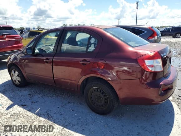 ✅ 2009 Suzuki SX4 FWD • VIN: JS2YC412896200836 • Лот: 80986245. Опубликован ранее на Copart с пробегом 214 579 миль. Бесплатный доступ к архиву аукционных продаж из США и подробный отчёт об истории автомобиля на DreamBid. Изображение 2.