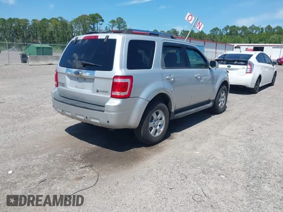 ✅ 2009 Ford Escape Hybrid • VIN: 1FMCU593X9KA59775 • Lot: 42763464. Listed on IAAI with 142,396 mi. Free auction sales archive from the USA and detailed vehicle history report at DreamBid. Image 4.