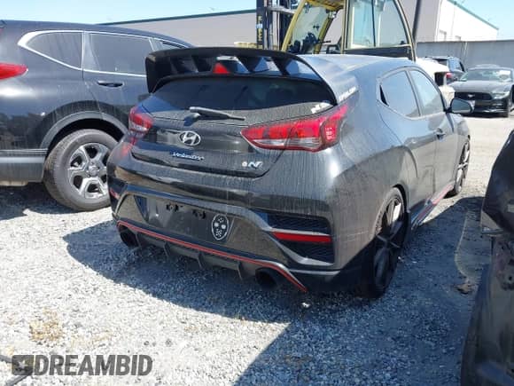 2020 Hyundai Veloster z VIN KMHT36AH1LU005437, wystawiony jako IAAI lot #42073273 z przebiegiem 97 089 mil mil oraz . Historia ofert i sprzedaży dostępna na DreamBid. Obrazek 4.