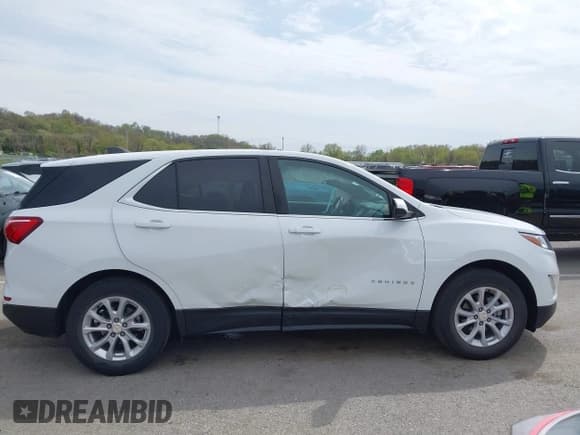 ✅ 2021 Chevrolet Equinox LT • VIN: 3GNAXKEV8MS140559 • Lot: 42014278. Listed on IAAI with 52,488 mi. Free auction sales archive from the USA and detailed vehicle history report at DreamBid. Image 13.