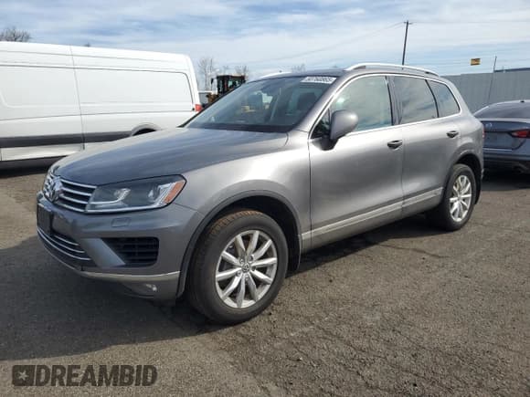 ✅ 2016 Volkswagen Touareg Sport • VIN: WVGEF9BPXGD007023 • Lot: 50760865. Listed on Copart with 96,657 mi. Free auction sales archive from the USA and detailed vehicle history report at DreamBid. Image 1.