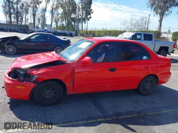 2003 Hyundai Accent GL z VIN KMHCG45C93U487209, wystawiony jako IAAI lot #41590636 z przebiegiem 118 811 mil mil oraz . Historia ofert i sprzedaży dostępna na DreamBid. Obrazek 14.