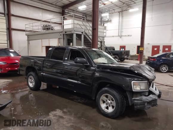 2009 Dodge Dakota z VIN 1D3HW38P49S789556, wystawiony jako IAAI lot #42475126 z przebiegiem Nie podano mil oraz . Historia ofert i sprzedaży dostępna na DreamBid. Obrazek 1.