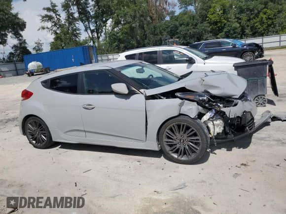2013 Hyundai Veloster w/Gray Int z VIN KMHTC6AD0DU156798, wystawiony jako Copart lot #64678554 z przebiegiem 119 578 mil mil oraz Szkoda całkowita • Salvage title. Historia ofert i sprzedaży dostępna na DreamBid. Obrazek 4.