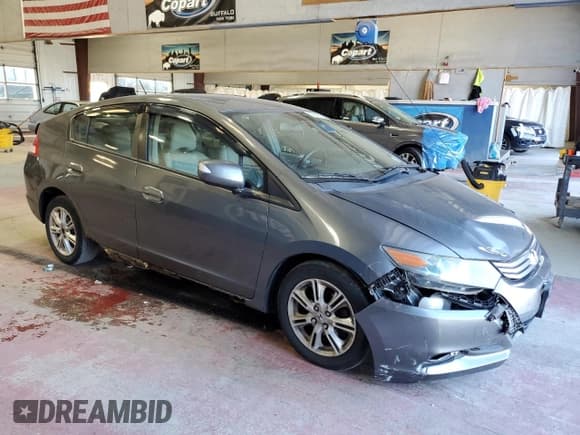 ✅ 2011 Honda Insight EX • VIN: JHMZE2H76BS006736 • Lot: 86318775. Listed on Copart with 178,777 mi. Free auction sales archive from the USA and detailed vehicle history report at DreamBid. Image 4.