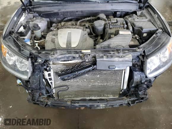 2012 Hyundai Santa Fe Limited с VIN 5XYZKDAGXCG152385, выставлен на аукционе Copart как лот 63775244 с пробегом 149 243 миль миль и Списание • Salvage title. История ставок и продаж доступна на DreamBid. Изображение 12.