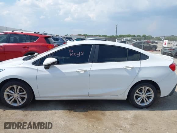 ✅ 2019 Chevrolet Cruze LS • VIN: 1G1BC5SM1K7110801 • Lot: 43252138. Listed on IAAI with 126,551 mi. Free auction sales archive from the USA and detailed vehicle history report at DreamBid. Image 14.