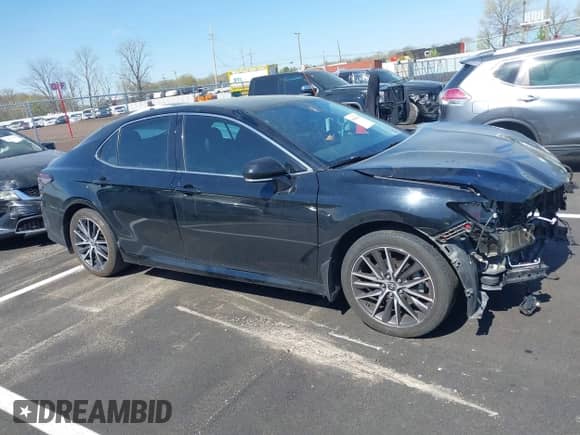 2022 Toyota Camry Hybrid XLE with VIN 4T1F31AK5NU594457, listed as a IAAI auction lot 41884438 with 69,767 mi miles and . Bid and sale history available at DreamBid. Image 13.