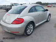 ✅ 2013 Volkswagen Beetle 2.0L TDI • VIN: 3VWJL7AT7DM690780 • Lot: 41200106. Listed on IAAI with 208,427 mi. Free auction sales archive from the USA and detailed vehicle history report at DreamBid. Image 4.