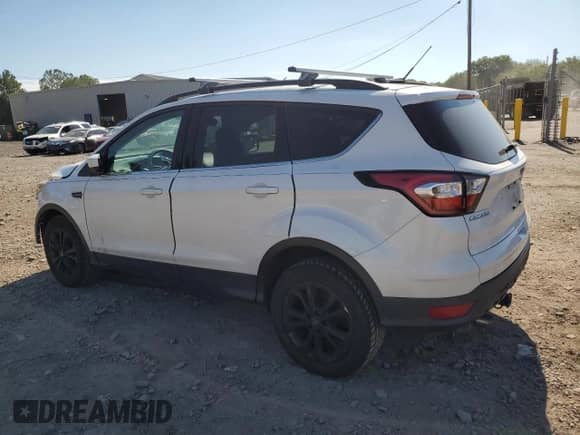 2018 Ford Escape SE z VIN 1FMCU9GD6JUA15204, wystawiony jako Copart lot #70722475 z przebiegiem 116 486 mil mil oraz Szkoda całkowita • Salvage title. Historia ofert i sprzedaży dostępna na DreamBid. Obrazek 2.