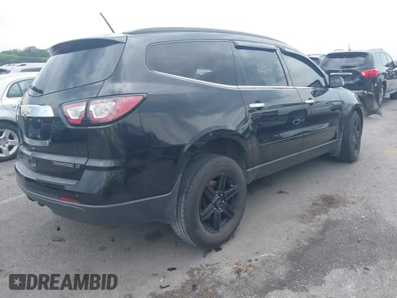 ✅ 2015 Chevrolet Traverse LT • VIN: 1GNKRHKD9FJ198777 • Lot: 42926991. Listed on IAAI with 153,634 mi. Free auction sales archive from the USA and detailed vehicle history report at DreamBid. Image 4.