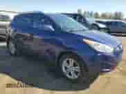 2011 Hyundai Tucson Limited with VIN KM8JUCAC3BU244297, listed as a Copart auction lot 48629585 with 208,270 mi miles and Salvage title. Bid and sale history available at DreamBid. Image 4.