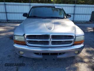 2004 Dodge Dakota SLT z VIN 1D7GL42N54S750919, wystawiony jako Copart lot #74625574 z przebiegiem 174 107 mil mil oraz Czysty tytuł • Clean title. Historia ofert i sprzedaży dostępna na DreamBid. Obrazek 5.