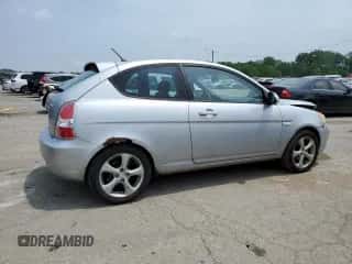 2007 Hyundai Accent SE with VIN KMHCN36CX7U038061, listed as a Copart auction lot 63790134 with 104,618 mi miles and Salvage title. Bid and sale history available at DreamBid. Image 3.