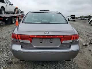 2006 Hyundai Azera SE z VIN KMHFC46F16A103916, wystawiony jako Copart lot #79886264 z przebiegiem 102 506 mil mil oraz Szkoda całkowita • Salvage title. Historia ofert i sprzedaży dostępna na DreamBid. Obrazek 6.