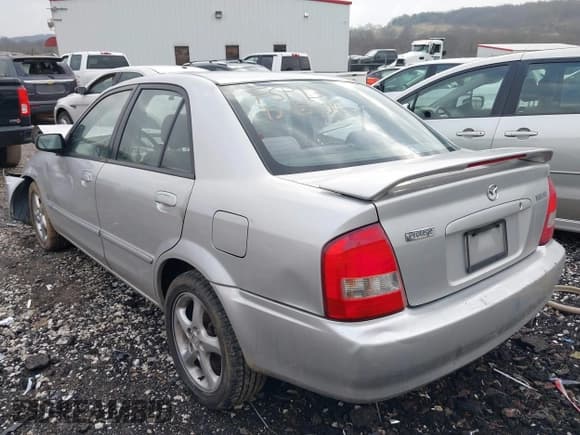 ✅ 2001 Mazda Protege LX • VIN: JM1BJ226910475036 • Lot: 41428483. Wystawiony na IAAI z przebiegiem 155 732 mil. Bezpłatny archiwum sprzedaży aukcyjnych z USA i szczegółowy raport historii pojazdu na DreamBid. Zdjęcie 3.