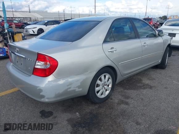 ✅ 2004 Toyota Camry LE • VIN: 4T1BF32KX4U577765 • Lot: 43725664. Listed on IAAI with 105,989 mi. Free auction sales archive from the USA and detailed vehicle history report at DreamBid. Image 4.