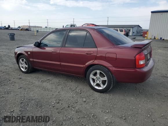 ✅ 2003 Mazda Protege DX • VIN: JM1BJ225930126453 • Лот: 80286785. Опубликован ранее на Copart с пробегом 106 034 миль. Бесплатный доступ к архиву аукционных продаж из США и подробный отчёт об истории автомобиля на DreamBid. Изображение 2.