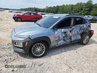 ✅ 2021 Hyundai Kona SEL • VIN: KM8K22AA1MU616807 • Лот: 67947195. Опубликован ранее на Copart с пробегом 102 798 миль. Бесплатный доступ к архиву аукционных продаж из США и подробный отчёт об истории автомобиля на DreamBid. Изображение 1.