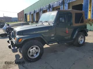 ✅ 2003 Jeep Wrangler Sahara • VIN: 1J4FA59S73P339658 • Lot: 60746155. Listed on Copart with 141,234 mi. Free auction sales archive from the USA and detailed vehicle history report at DreamBid. Image 1.