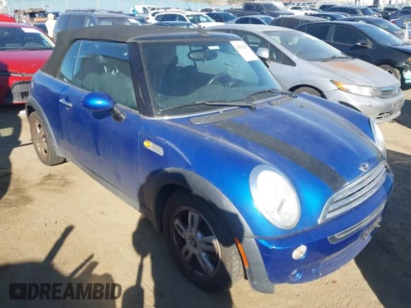 ✅ 2006 MINI Convertible • VIN: WMWRF33576TG14873 • Lot: 43592857. Listed on IAAI with 104,184 mi. Free auction sales archive from the USA and detailed vehicle history report at DreamBid. Image 1.