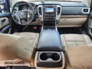 ✅ 2016 Nissan Titan Platinum Reserve • VIN: 1N6BA1F4XGN504751 • Lot: 90842885. Listed on Copart with 143,772 mi. Free auction sales archive from the USA and detailed vehicle history report at DreamBid. Image 8.