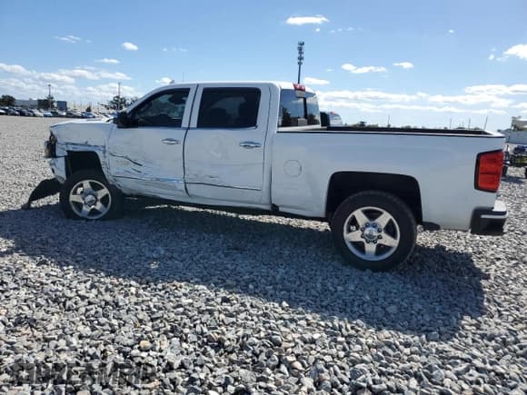 ✅ 2015 Chevrolet Silverado 2500HD High Country • VIN: 1GC1KXE85FF677959 • Lot: 90101215. Listed on Copart with 146,383 mi. Free auction sales archive from the USA and detailed vehicle history report at DreamBid. Image 2.